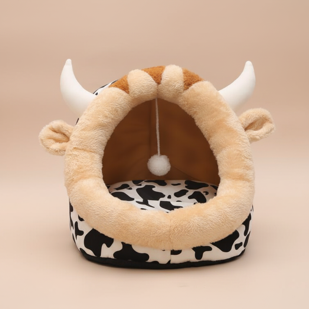 Cow print pet bed - nude studio background